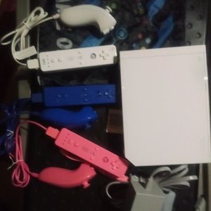 Nintendo Wii console with 3 remotes,and Wii sports game